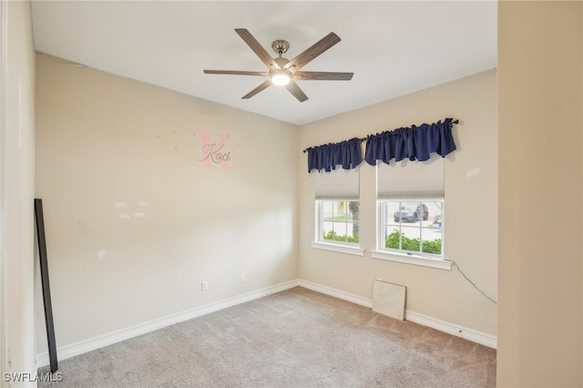 empty room featuring ceiling fan and carpet floors