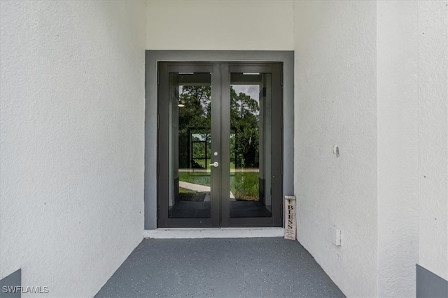 doorway to property featuring french doors