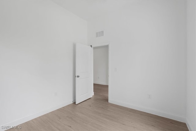 spare room featuring light wood-type flooring