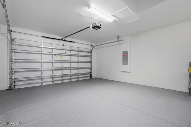 garage with a garage door opener and electric panel