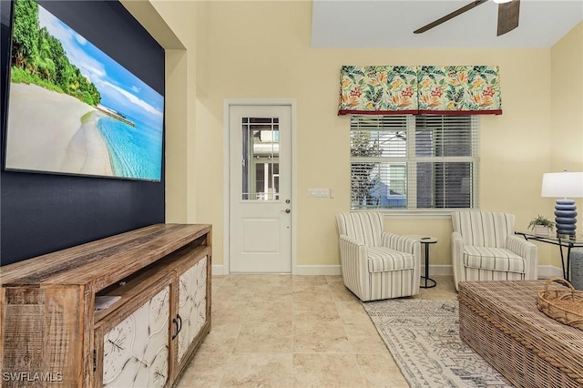 sitting room featuring ceiling fan