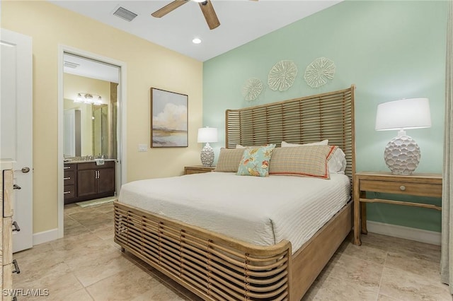 bedroom with light tile patterned floors, connected bathroom, and ceiling fan