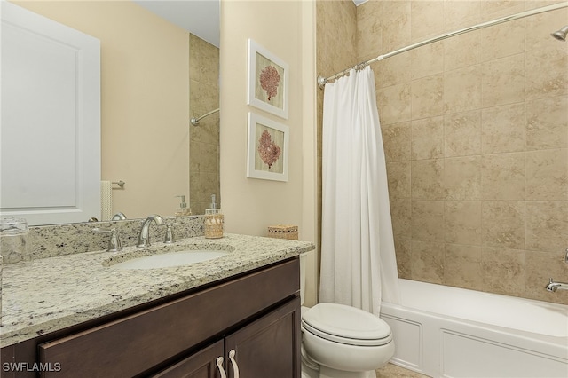 full bathroom featuring shower / bath combo, toilet, and vanity