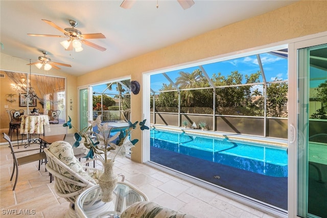 outdoor pool featuring a ceiling fan