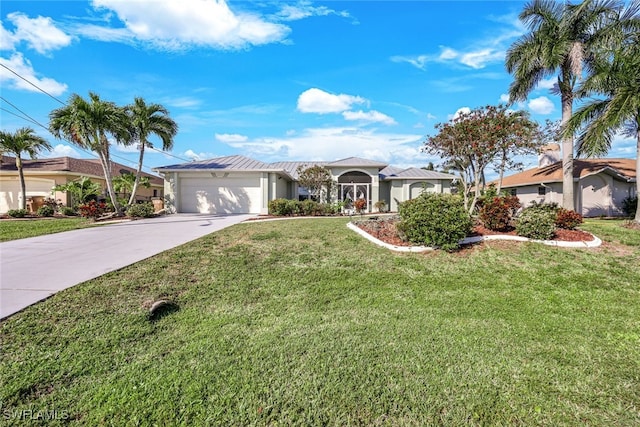 ranch-style house featuring a garage and a front lawn