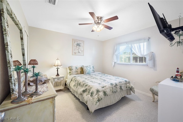 bedroom featuring visible vents, baseboards, ceiling fan, and light colored carpet