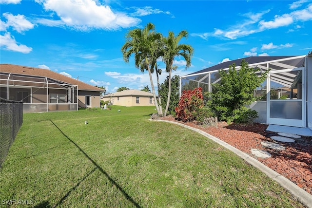 view of yard with a lanai