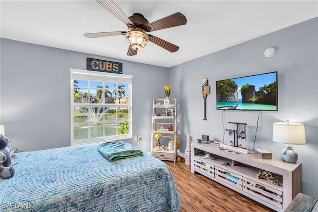 bedroom featuring ceiling fan and hardwood / wood-style floors