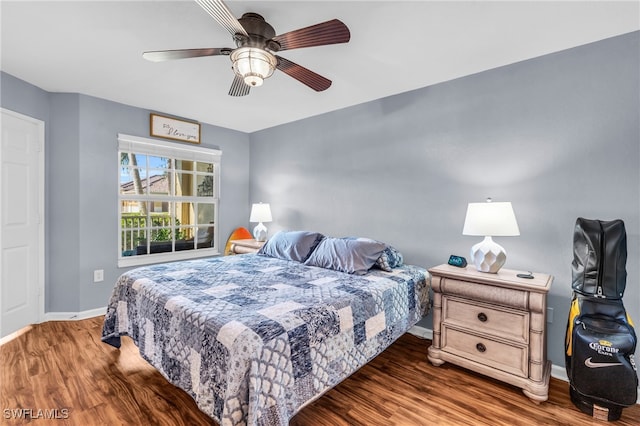 bedroom with ceiling fan and dark wood-type flooring