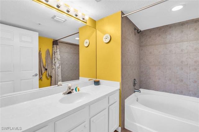 bathroom featuring shower / bath combination with curtain and vanity