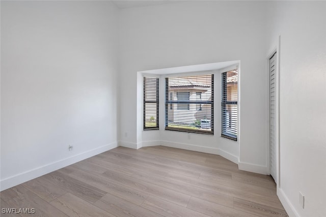 spare room with light hardwood / wood-style floors