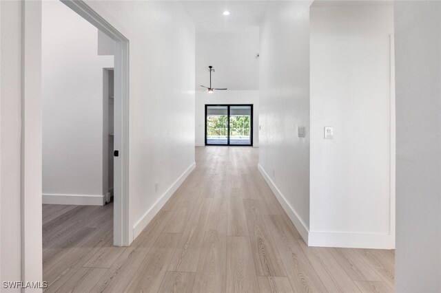 hallway with light wood-type flooring