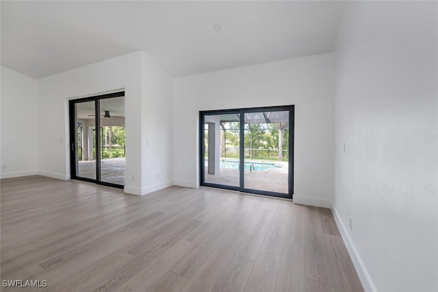 spare room with light hardwood / wood-style flooring