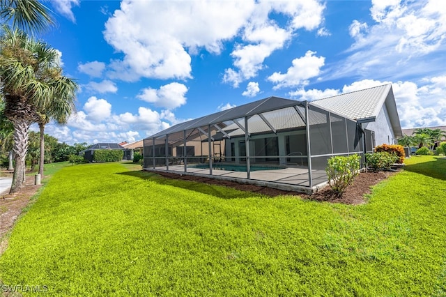 exterior space featuring a lanai and a lawn