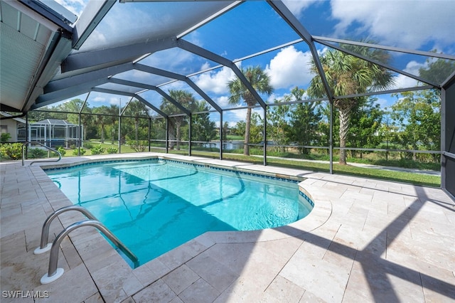 view of swimming pool featuring glass enclosure and a patio