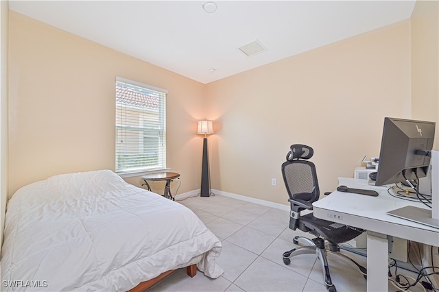 bedroom with light tile patterned flooring