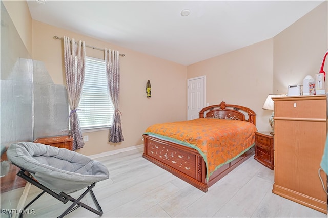 bedroom with light wood-type flooring