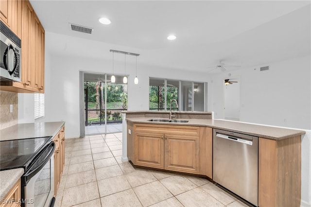 kitchen featuring appliances with stainless steel finishes, light tile patterned floors, ceiling fan, decorative light fixtures, and sink