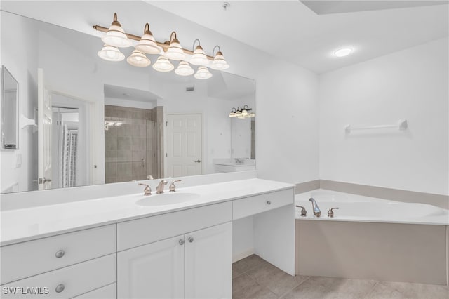 bathroom with tile patterned flooring, independent shower and bath, and vanity