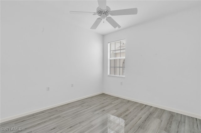 empty room with ceiling fan and light wood-type flooring