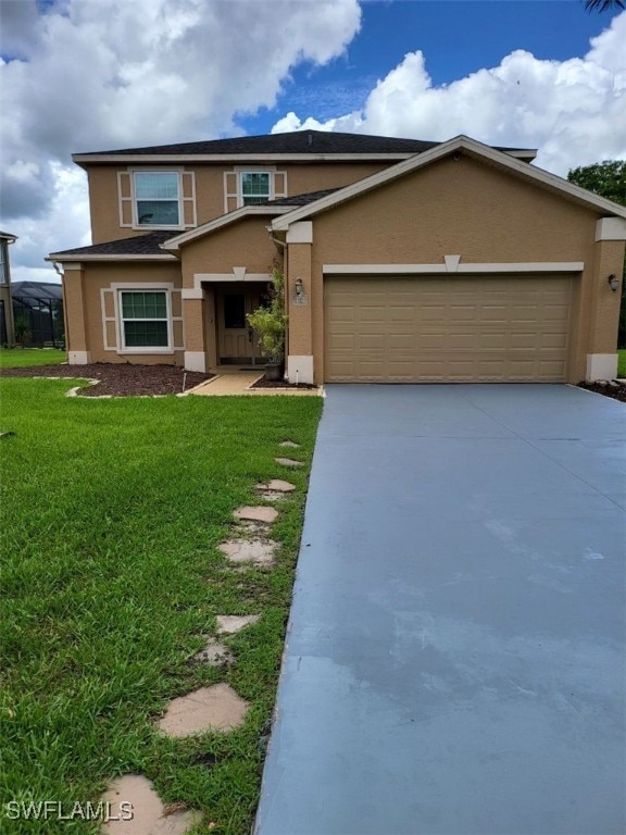 view of front of house with a front lawn and a garage