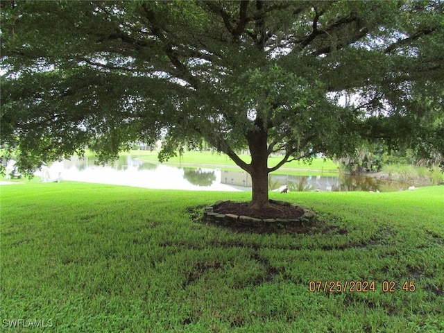 13520 Cypress Head Dr, Fort Myers, FL 33913 - view of grassy yard featuring a water view