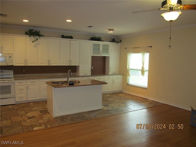 kitchen with white appliances, dark hardwood / wood-style floors, and white cabinetry