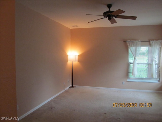 carpeted empty room with ceiling fan