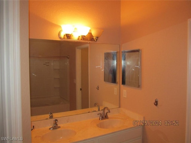 13520 Cypress Head Dr, Fort Myers, FL 33913 - full bathroom featuring double vanity and washtub / shower combination