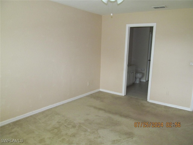 unfurnished room with ceiling fan and carpet floors