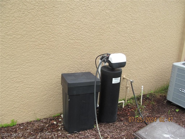13520 Cypress Head Dr, Fort Myers, FL 33913 - exterior view of stucco siding, central air condition unit, and a water softener system