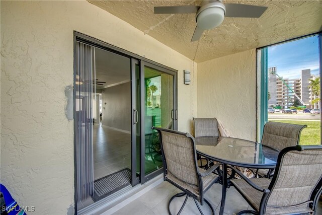 exterior space with ceiling fan