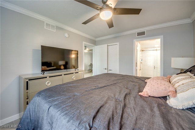 bedroom featuring a closet, connected bathroom, ceiling fan, and crown molding