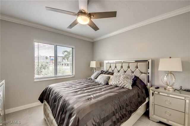 bedroom featuring light tile patterned floors, ornamental molding, and ceiling fan