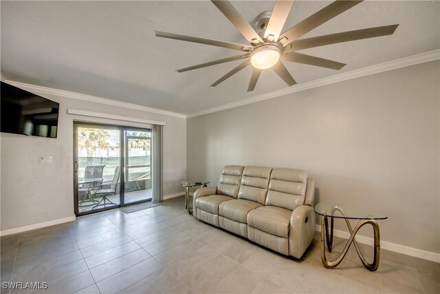 tiled living room with ceiling fan and crown molding