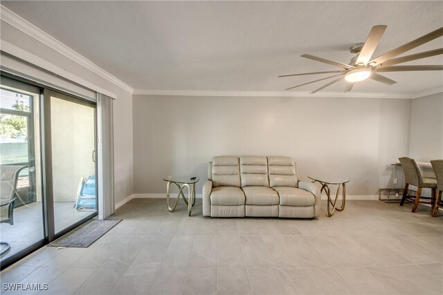 living room with ornamental molding, ceiling fan, and light tile patterned flooring