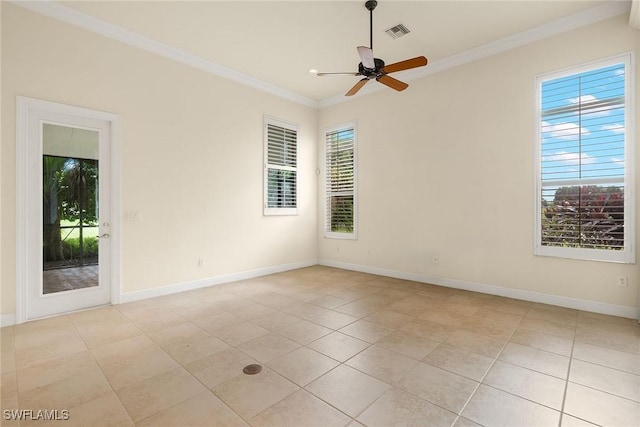 empty room with crown molding, ceiling fan, and light tile patterned flooring