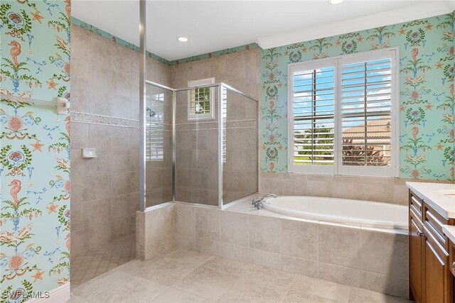 bathroom featuring vanity and plus walk in shower