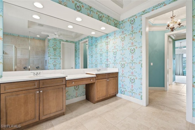 bathroom featuring vanity, crown molding, a shower with shower door, and ceiling fan with notable chandelier