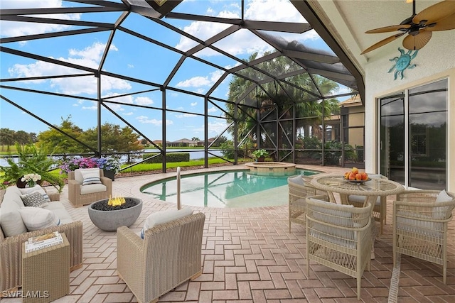 view of pool with an in ground hot tub, a patio area, ceiling fan, and a lanai