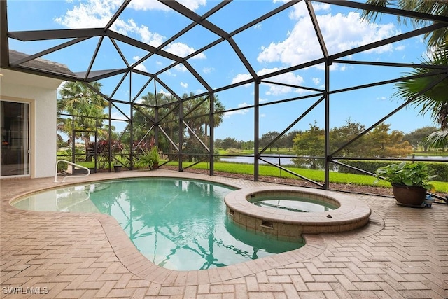 view of swimming pool with an in ground hot tub, glass enclosure, and a patio area