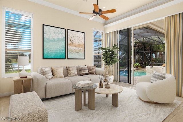 living room with ceiling fan and ornamental molding