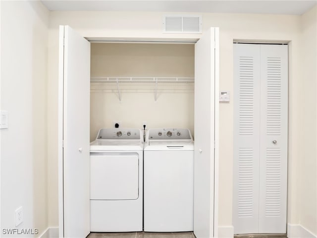 laundry room with independent washer and dryer