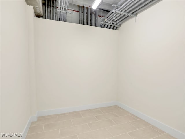 spacious closet featuring tile patterned flooring