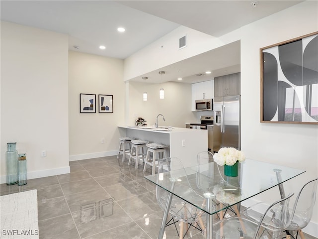 dining room featuring sink