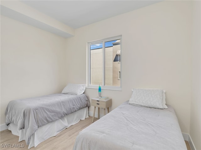 bedroom with hardwood / wood-style floors