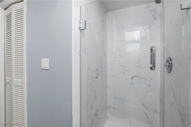 bathroom with a shower with shower door