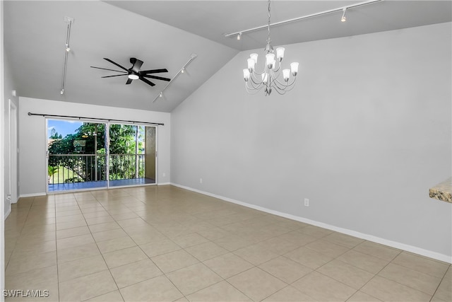 spare room featuring ceiling fan with notable chandelier, vaulted ceiling, track lighting, and light tile patterned floors