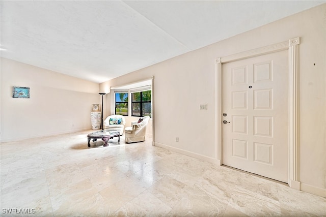 entryway featuring vaulted ceiling