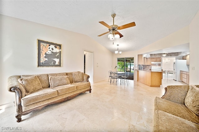 living room featuring lofted ceiling, ceiling fan, and a textured ceiling